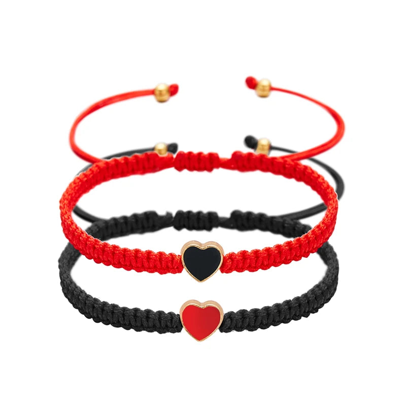 Red and black beaded friendship bracelets with heart charms for couples