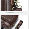 Close-up of a brown leather laptop briefcase showing durable hardware and an adjustable strap.