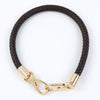 Black braided PU leather replacement bag strap with gold-toned metal buckles