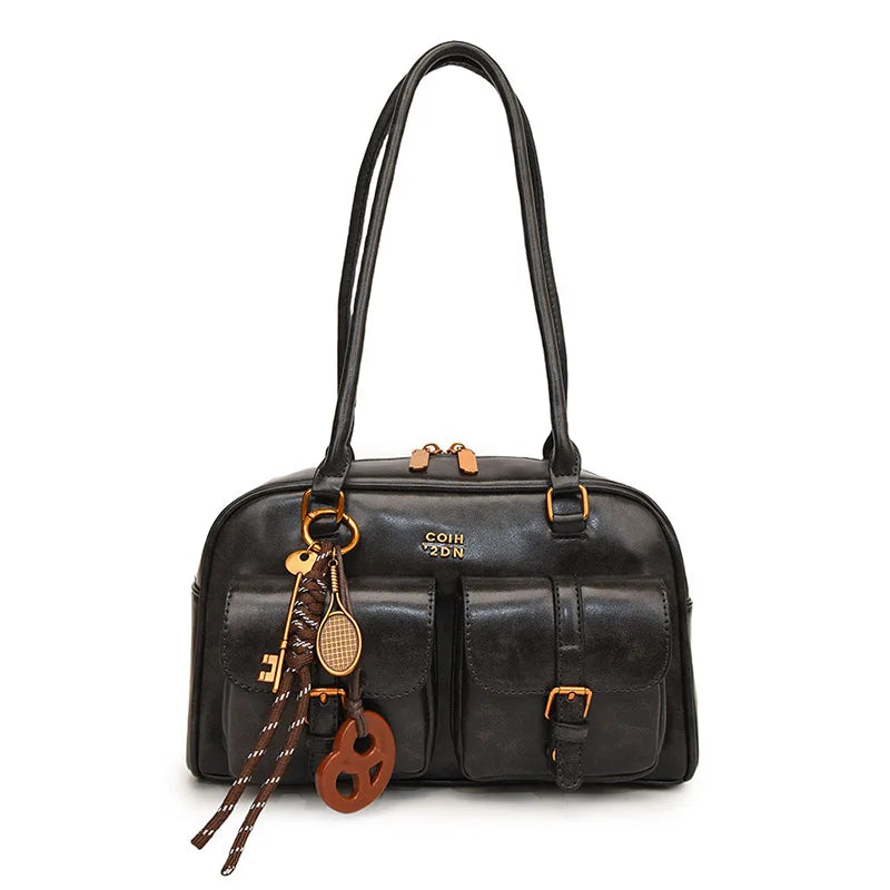 A black vintage letter print crossbody bag with a leather strap and wooden accents.