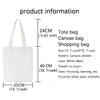 White canvas tote bag with handles shown next to a measurement guide.