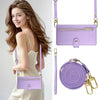 A woman models a purple leather crossbody phone case for an iPhone.
