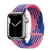 A silver Apple Watch is shown alongside a braided pink and blue stretch band.