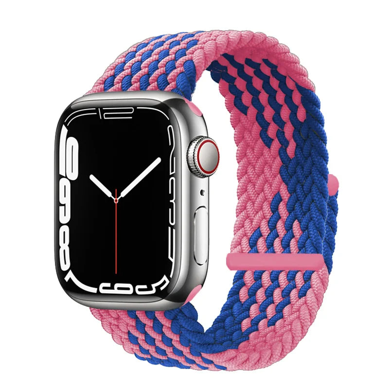 A silver Apple Watch is shown alongside a braided pink and blue stretch band.