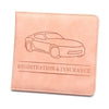 A light peach leather glove box wallet with a line drawing of a car and text reading Registration & Insurance.