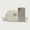 A light beige crossbody bag featuring a repeating monogram pattern, paired with a smartphone.