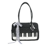 Black and white piano print crossbody bag featuring a musical note embroidery charm