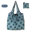 A reusable eco tote shopping bag with a geometric pattern in shades of blue and green.