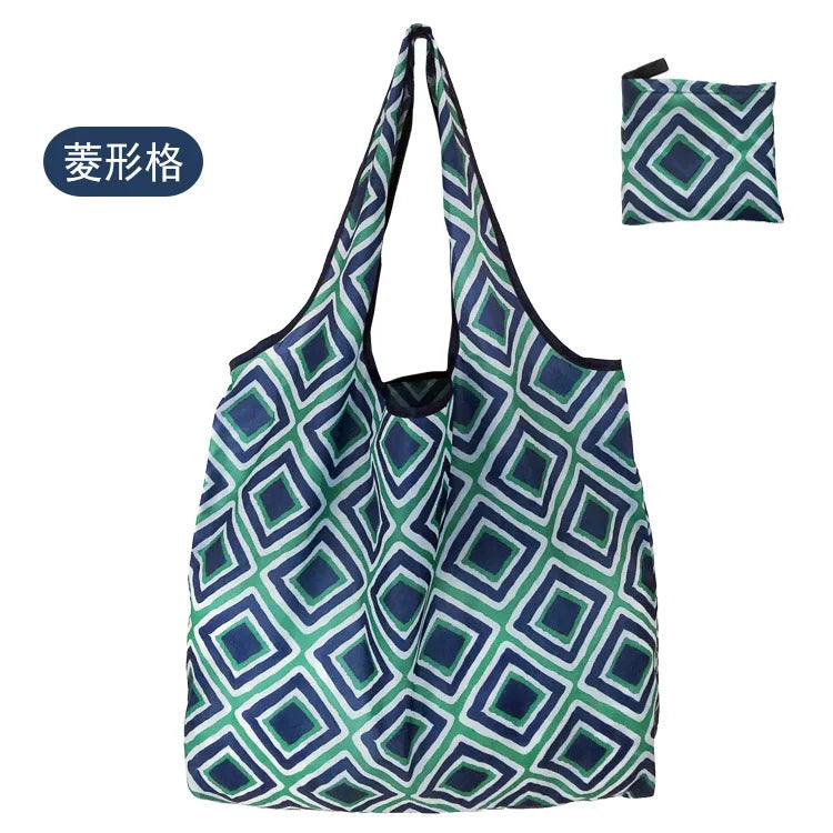 A reusable eco tote shopping bag with a geometric pattern in shades of blue and green.