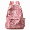 A pink leopard print laptop backpack with padded straps.