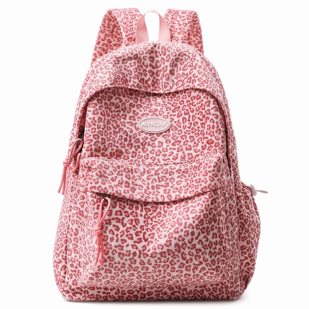 A pink leopard print laptop backpack with padded straps.