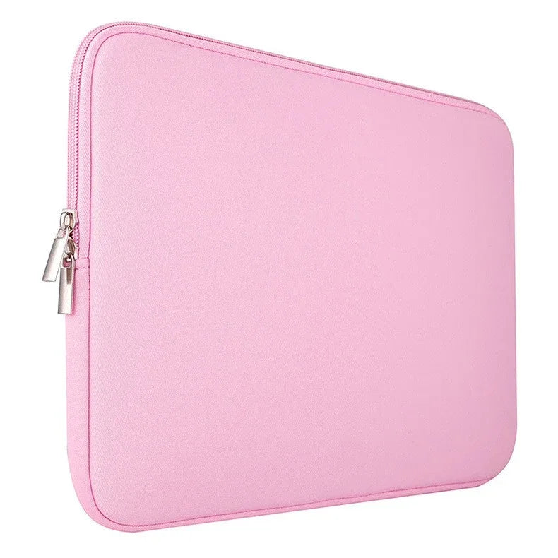 A pink shockproof laptop sleeve with a zipper and soft velvet lining.