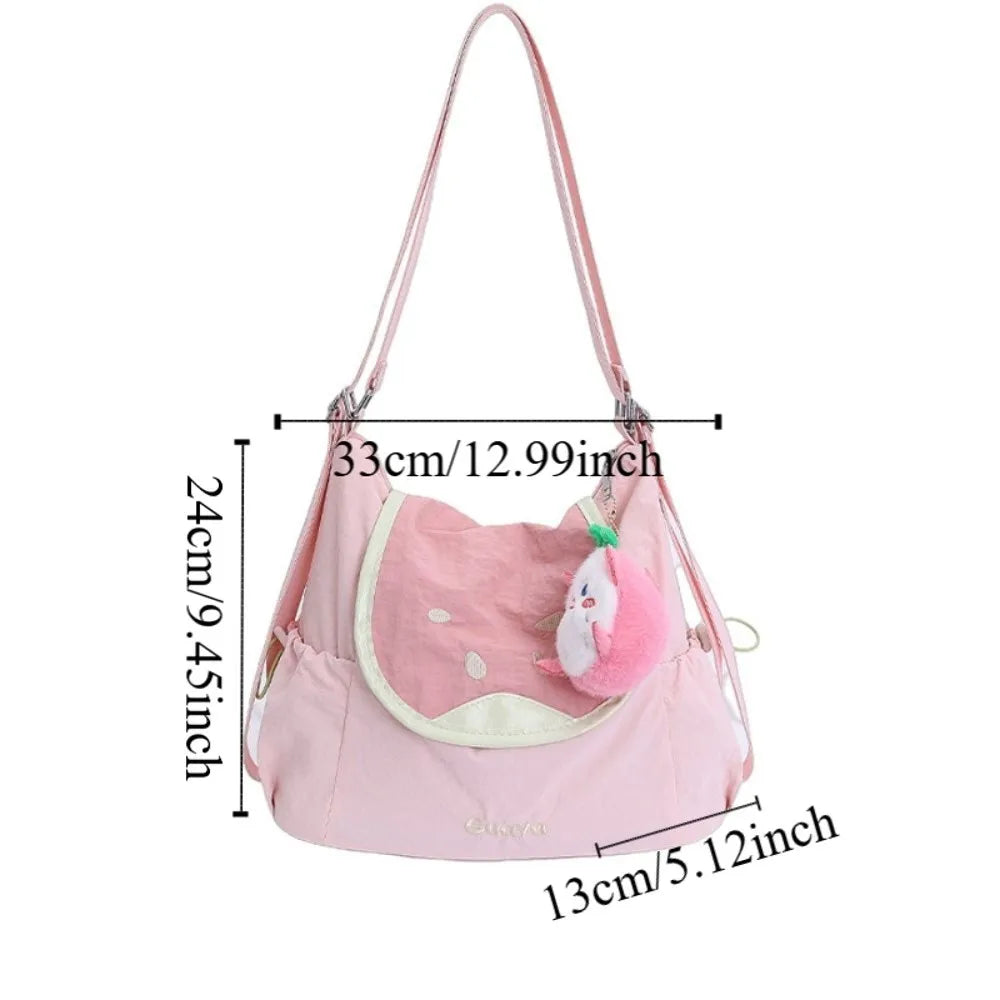 Pink nylon messenger backpack with a white and pink bear face design