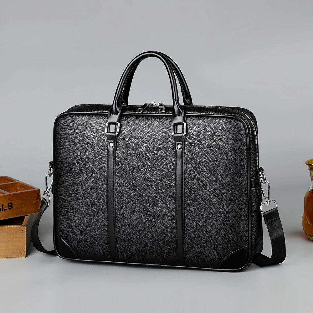 Black luxury PU leather business briefcase with a handle and shoulder strap.