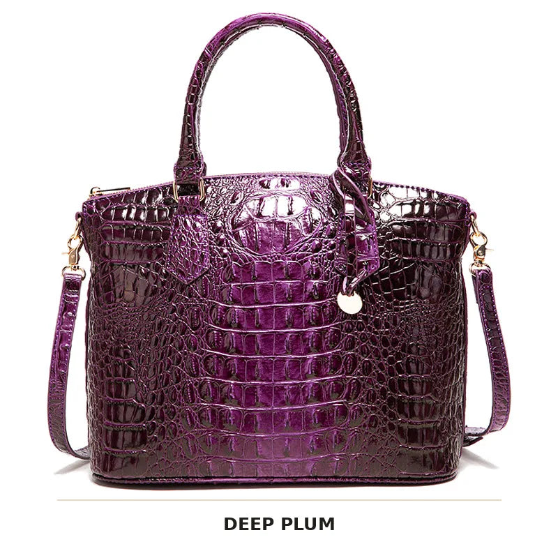 Dunkelviolette Krokodilmuster-Top mit Henkel und Crossbody-Tasche.