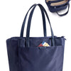 Navy blue premium women's laptop tote bag with a flap and shoulder strap shown next to a folded version