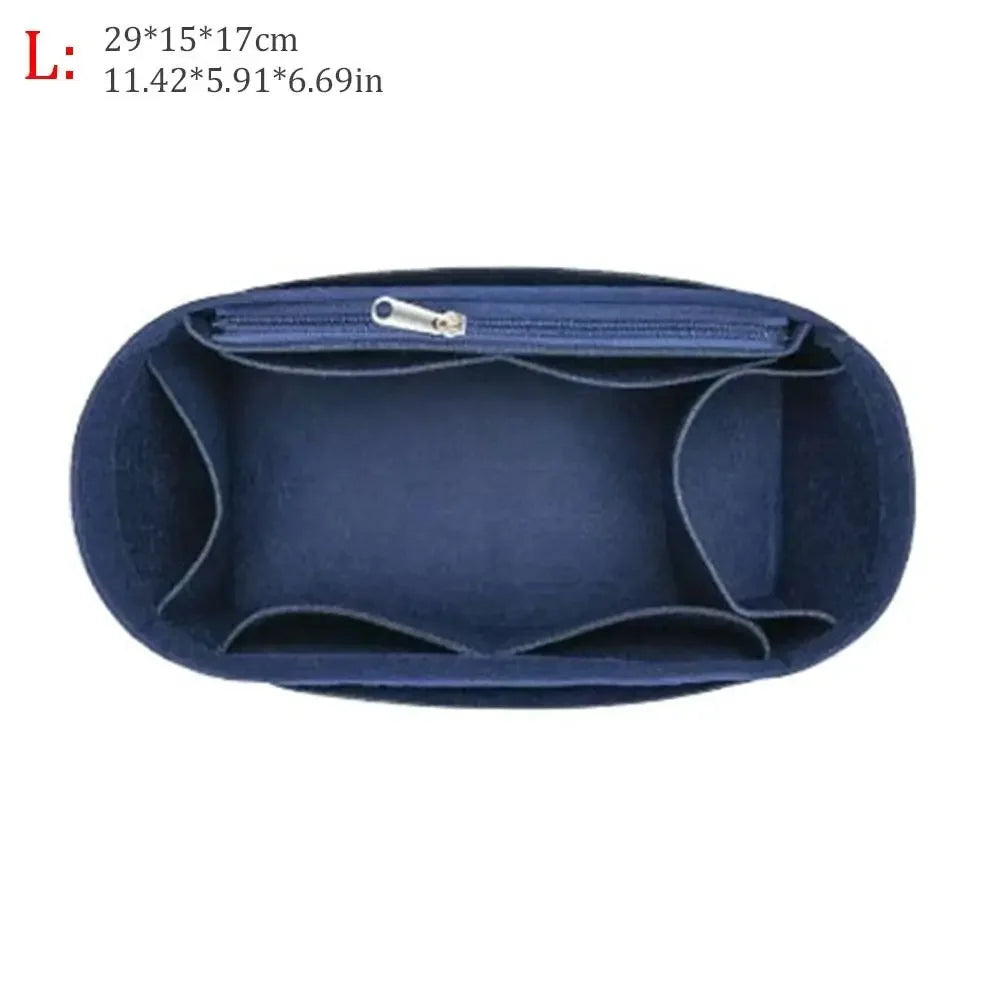 Dark blue dustproof felt insert liner for a handbag with a zippered opening.
