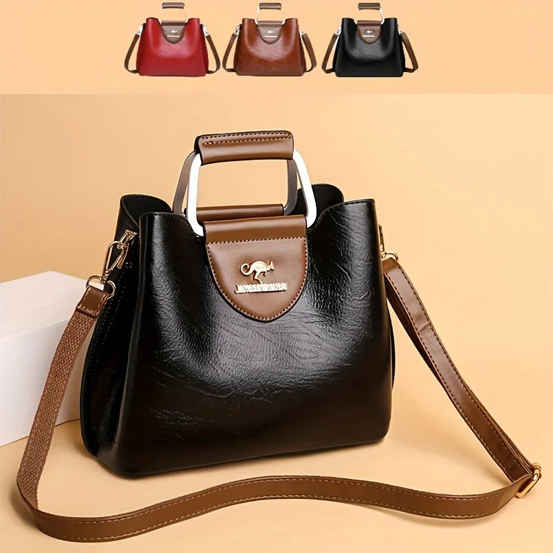 Sac bandoulière vintage en cuir noir avec plusieurs poches et garniture marron.