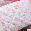 Pinkes, gestepptes Make-up-Aufbewahrungstasche mit rosa Schleifedetail