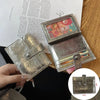 A close-up of a genuine leather compact coin purse and key holder in silver and gold tones.