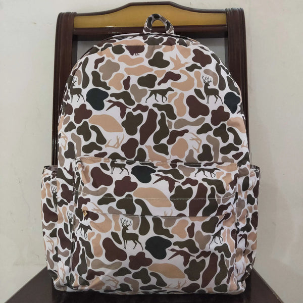 A camouflage patterned toddler backpack featuring various animal prints on a wooden hanger.