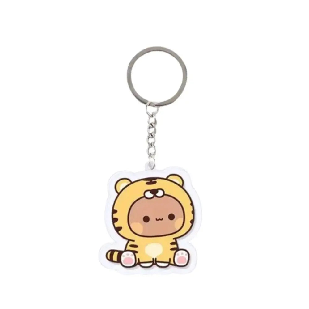 A cute cartoon tiger character charm made of resin attached to a silver keyring.