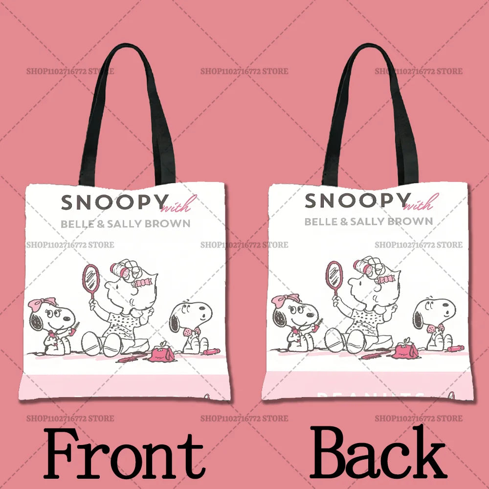 A pink tote bag featuring a cartoon illustration of Snoopy with Belle and Sally Brown