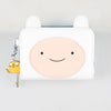 A white leather wallet featuring a round, smiling face design and a yellow charm.