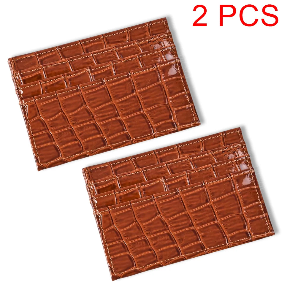 Two brown crocodile pattern slim card holder wallets