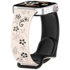Reloj inteligente plateado con correa de silicona floral beige y banda negra.