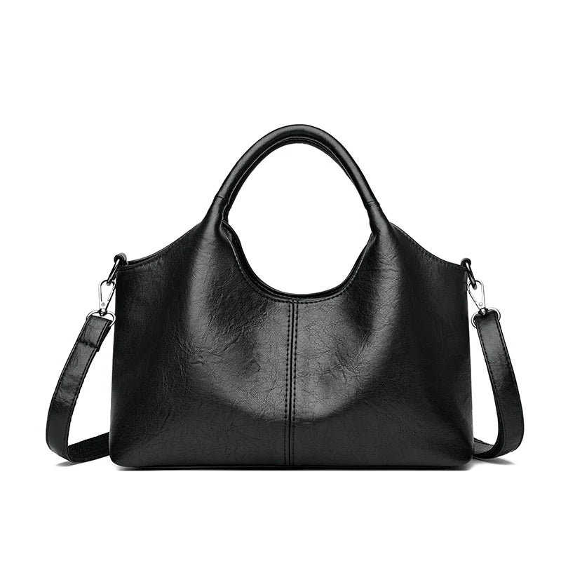 A black leather women's casual crossbody shoulder bag with a zip closure.