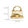A gold-toned square crossbody bag with a chain strap shown against a white background.