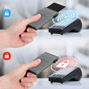 A hand holds a slim metal RFID credit card holder wallet next to a smartphone, demonstrating security features.