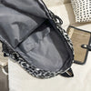 Gray leopard print canvas backpack open showing the interior lining and black straps