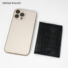 A beige smartphone is shown next to a black crocodile pattern slim card holder wallet.
