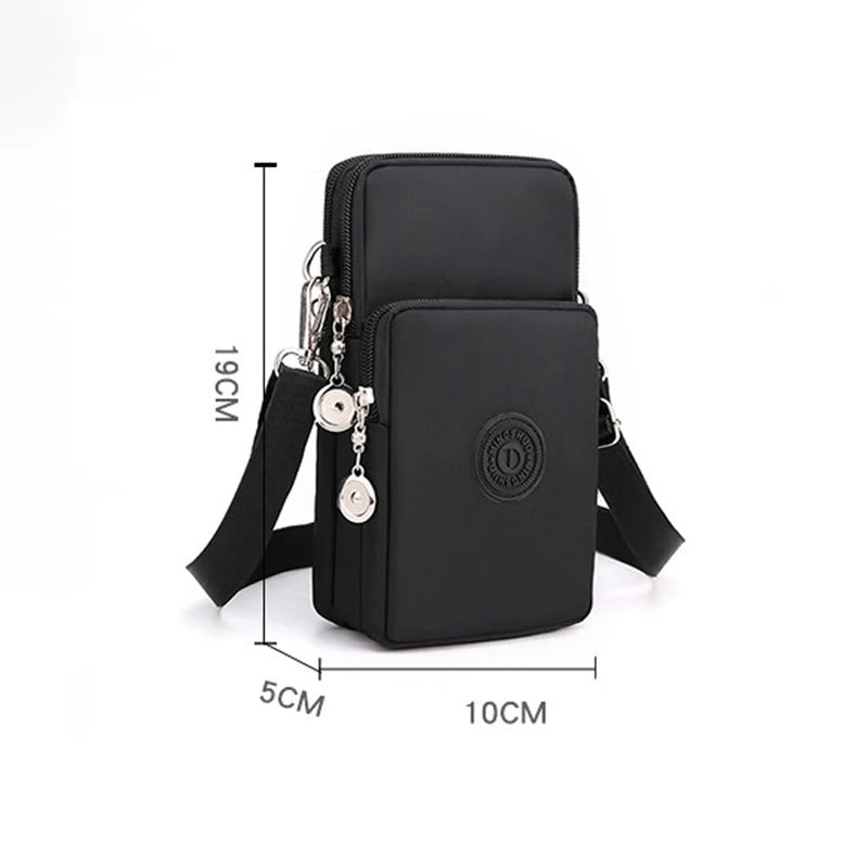 Black compact nylon crossbody phone bag with an adjustable strap shown from the side and top.