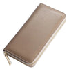 A tan genuine leather zipper wallet for women shown in a diagonal angle.