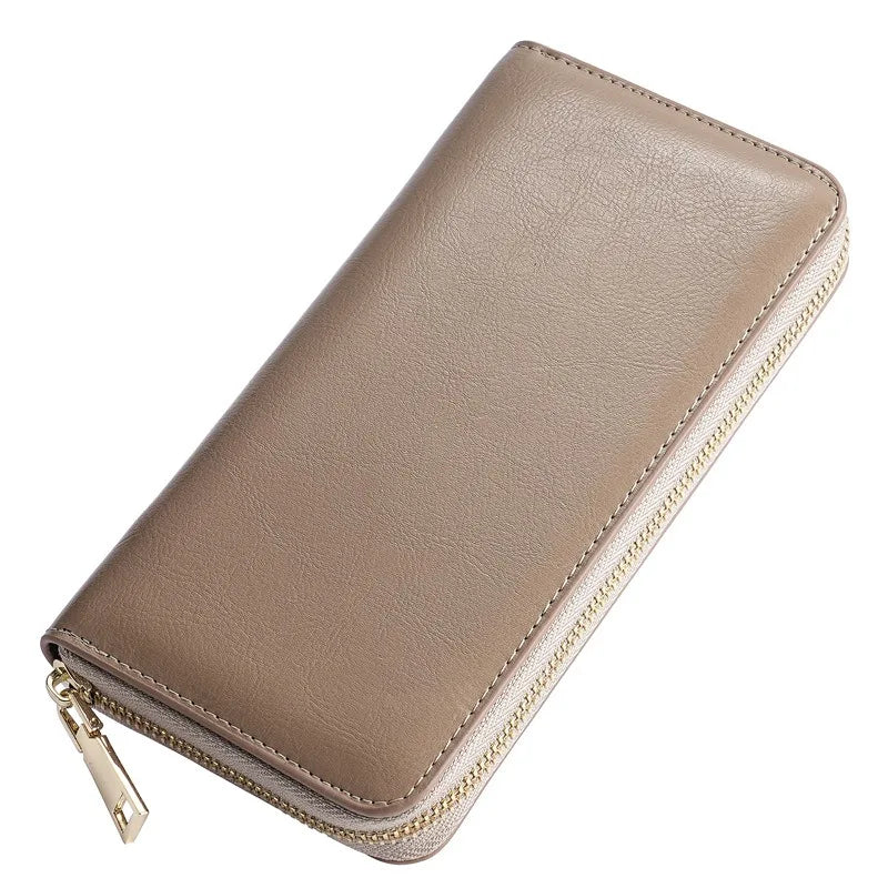 A tan genuine leather zipper wallet for women shown in a diagonal angle.