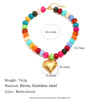 A multicolored bead necklace featuring resin and stainless steel beads with a gold heart charm.