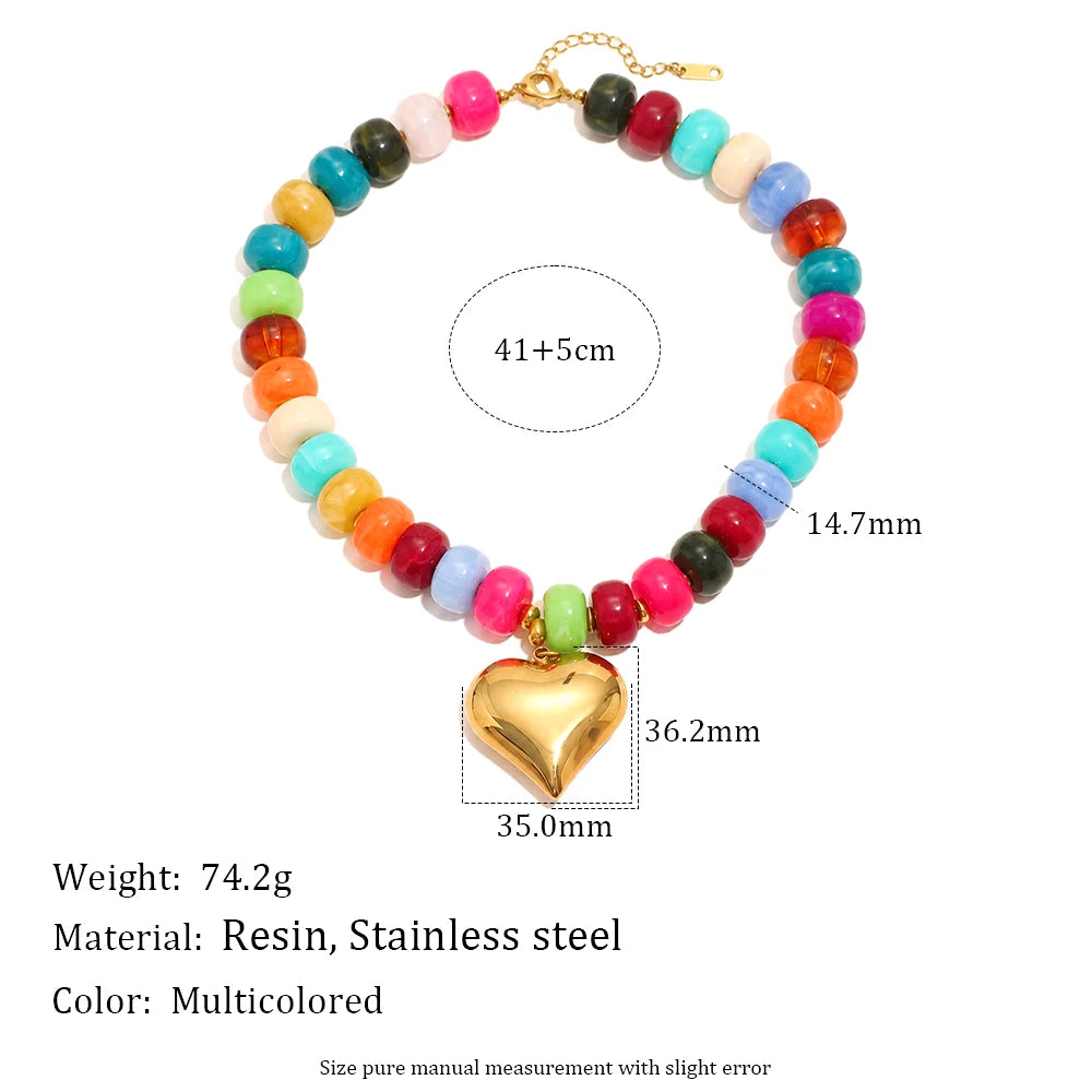 A multicolored bead necklace featuring resin and stainless steel beads with a gold heart charm.