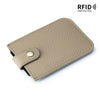 A beige genuine leather slim card holder with a stitched texture and a leather flap closure.
