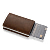 A brown leather minimalist wallet with a card slot displaying several credit cards.