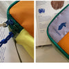 Orange and purple waterproof toiletry bag set with a blue drawstring closure