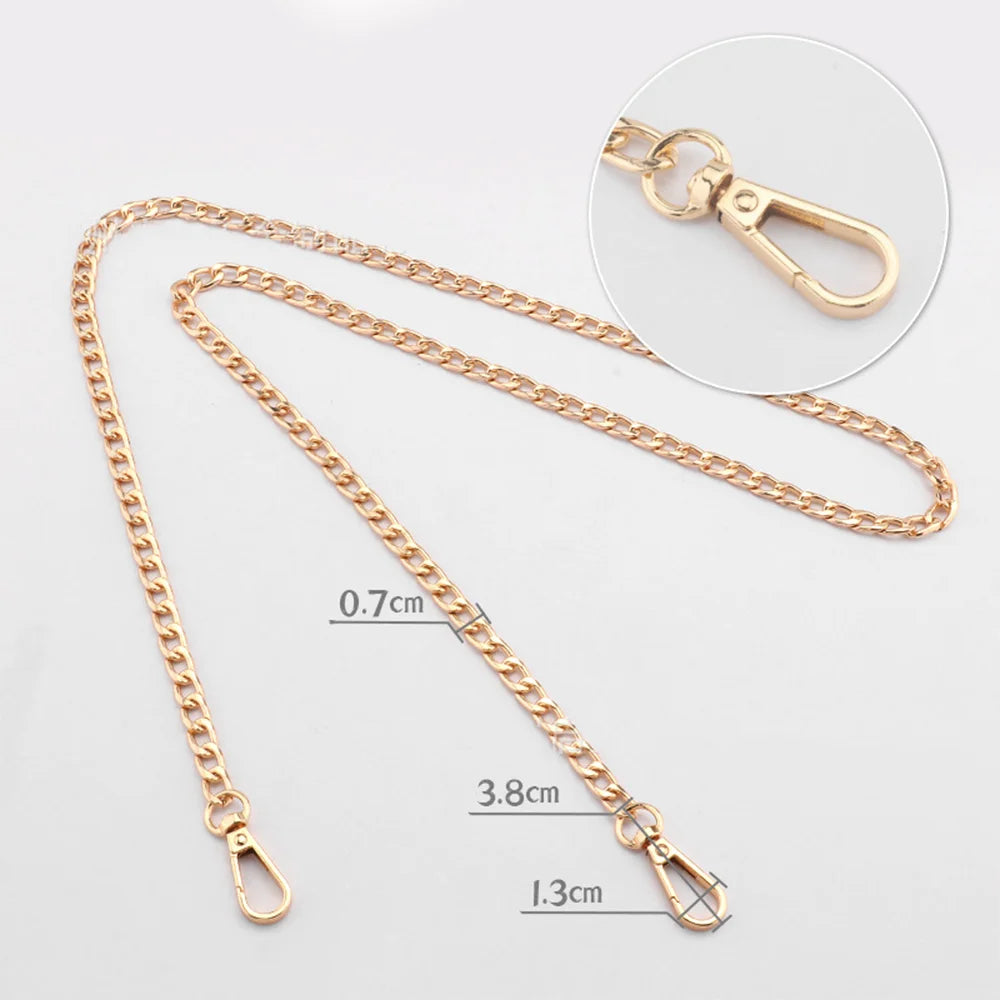 Gold-toned adjustable metal chain strap for a handbag, shown with a close-up of the clasp.