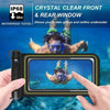 A hand holds a waterproof phone case with a clear front and rear window, showing a person underwater.