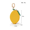 Yellow fruit-shaped PU leather coin purse keychain with a gold-colored clasp and green cord