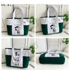 A white and green canvas tote bag featuring Snoopy graphics, shown in various styles.