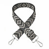 A black and white geometric patterned nylon shoulder strap for bags and purses.