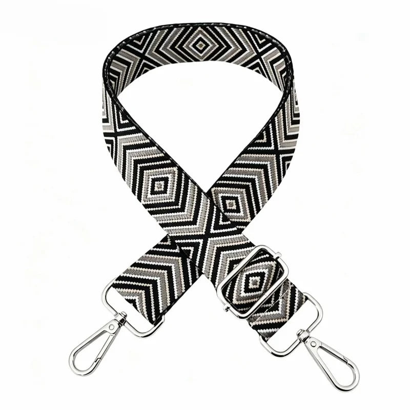 A black and white geometric patterned nylon shoulder strap for bags and purses.
