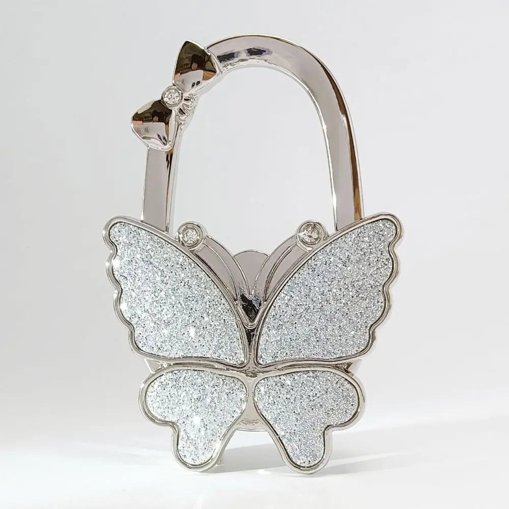 Silver foldable butterfly shaped handbag hook with sparkling glitter finish